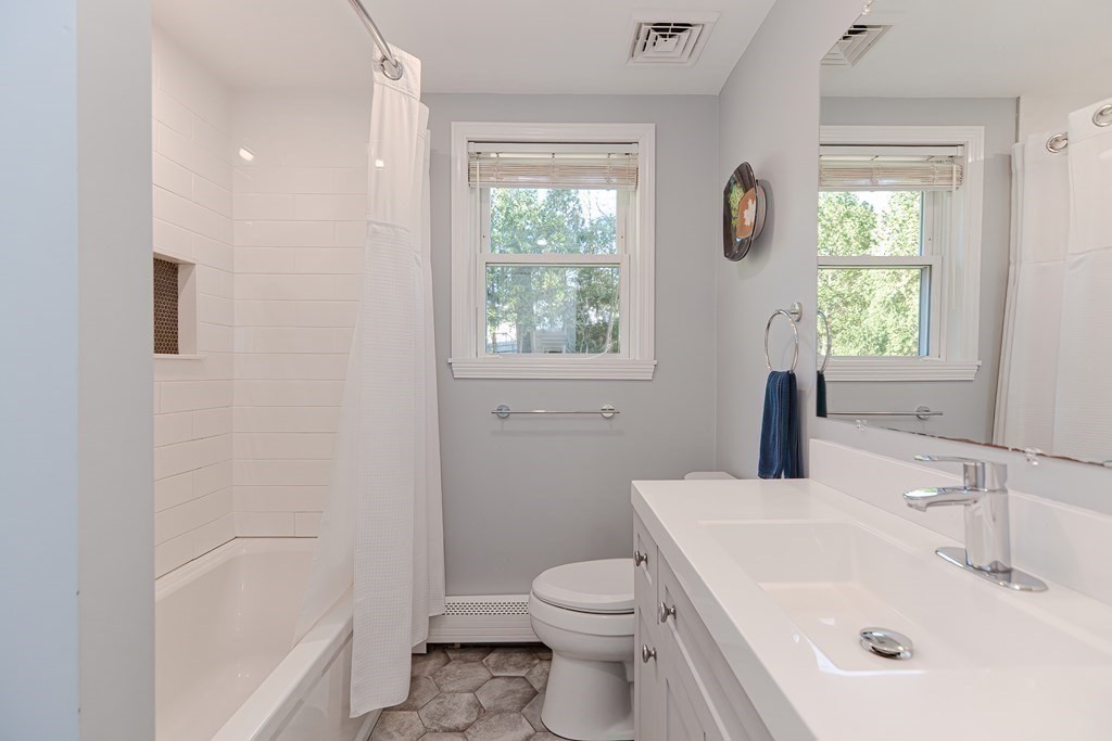 14 Oakcrest Drive Framingham, MA 01701 - Photo 16 of 42 a bathroom with a sink toilet and window
