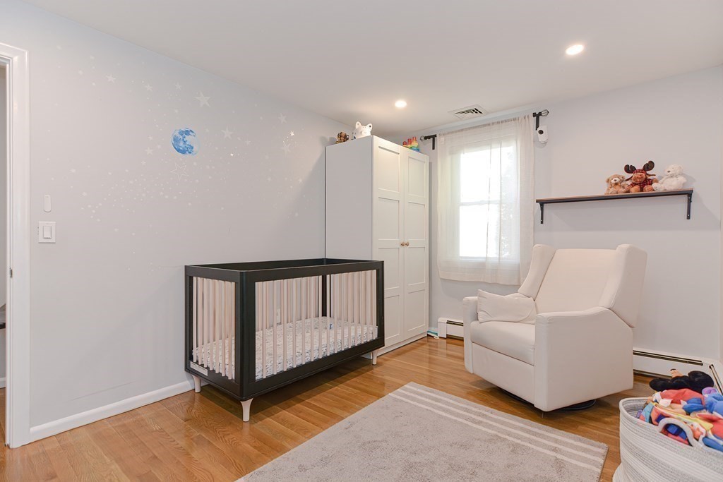 14 Oakcrest Drive Framingham, MA 01701 - Photo 23 of 42 a living room with furniture a rug and a window