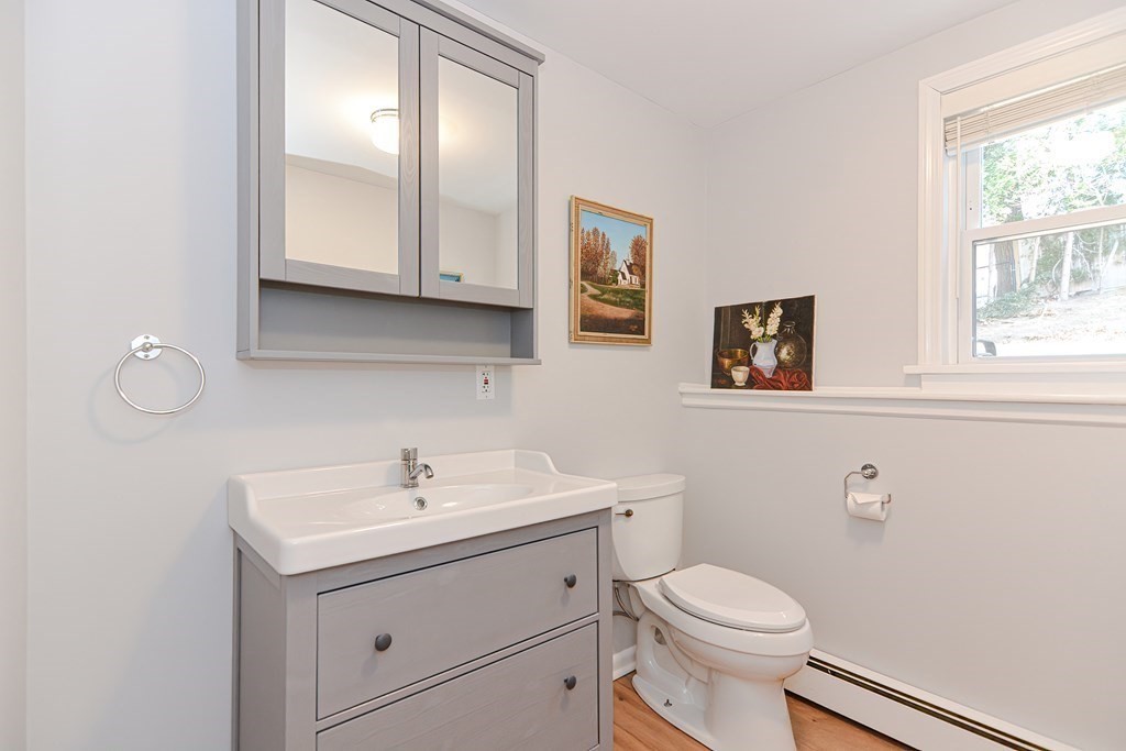 14 Oakcrest Drive Framingham, MA 01701 - Photo 28 of 42 a bathroom with a toilet sink and mirror