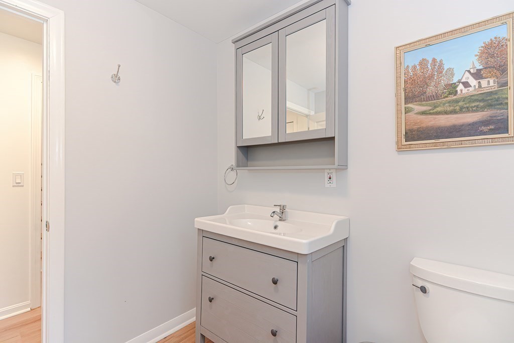 14 Oakcrest Drive Framingham, MA 01701 - Photo 29 of 42 a bathroom with a sink a mirror and a toilet