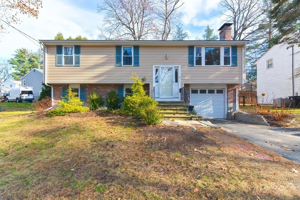 14 Oakcrest Drive Framingham, MA 01701 - Photo 40 of 42 a front view of a house with garden