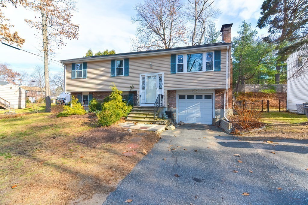 14 Oakcrest Drive Framingham, MA 01701 - Photo 41 of 42 a view of a house with a patio and a yard