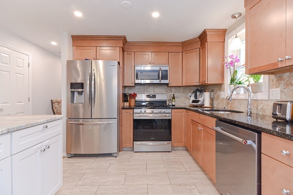14 Oakcrest Drive Framingham, MA 01701 - Photo 7 of 42 a kitchen with cabinets stainless steel appliances and a sink