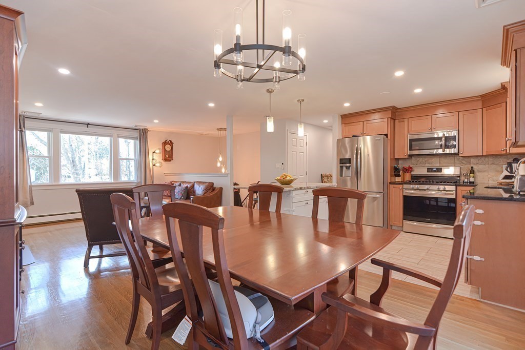 14 Oakcrest Drive Framingham, MA 01701 - Photo 10 of 42 a dining room with kitchen island furniture a chandelier and kitchen view