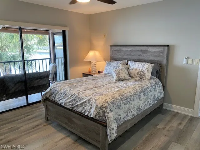 a large bed sitting in a bedroom next to a window