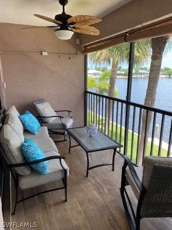 a view of a livingroom with furniture and a window