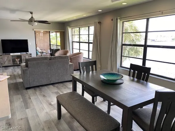 a view of a dining room with furniture and window