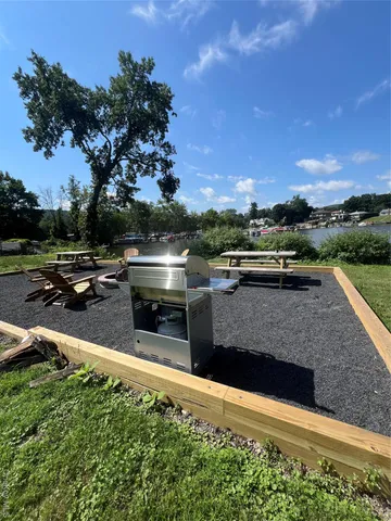 a view of swimming pool with outdoor seating and plants