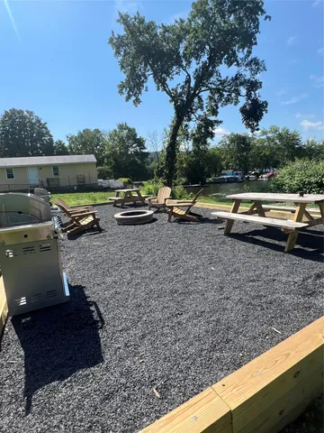 a view of a yard with sitting area
