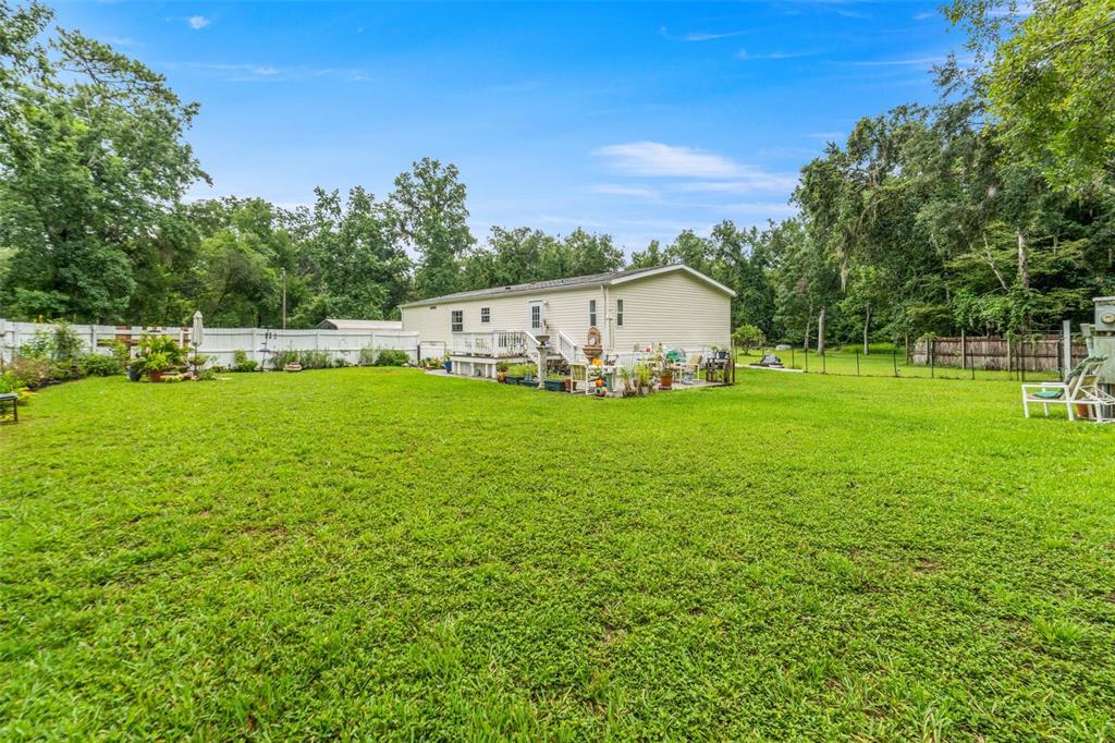 a view of a house with a big yard
