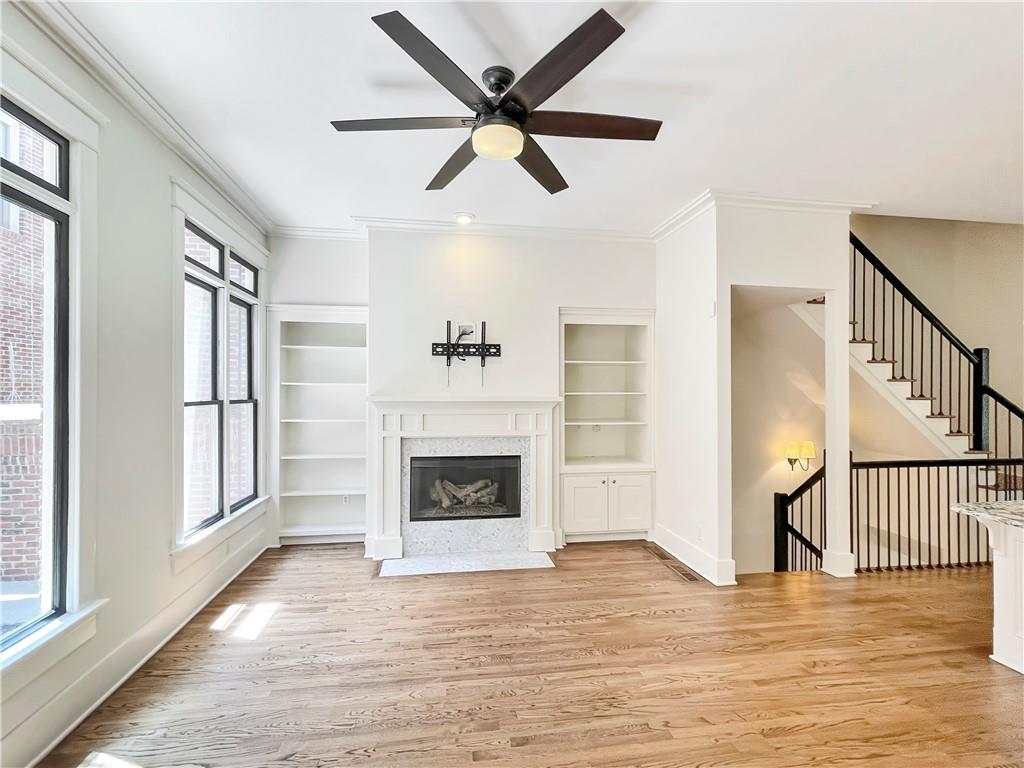 1867 Gordon Manor Northeast Atlanta, GA 30307 - Photo 12 of 34 a view of an empty room with wooden floor fireplace and a window