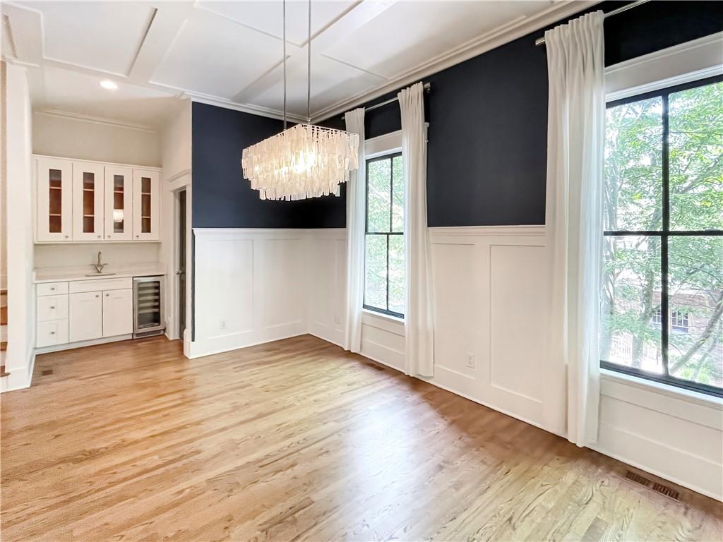 1867 Gordon Manor Northeast Atlanta, GA 30307 - Photo 16 of 34 an empty room with wooden floor and windows