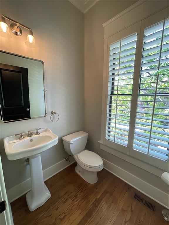 1867 Gordon Manor Northeast Atlanta, GA 30307 - Photo 18 of 34 a bathroom with a toilet sink and mirror