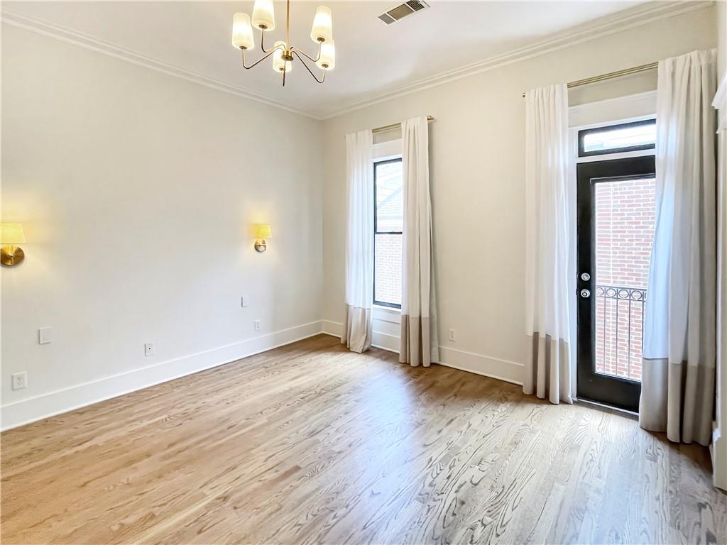 1867 Gordon Manor Northeast Atlanta, GA 30307 - Photo 22 of 34 an empty room with wooden floor and windows