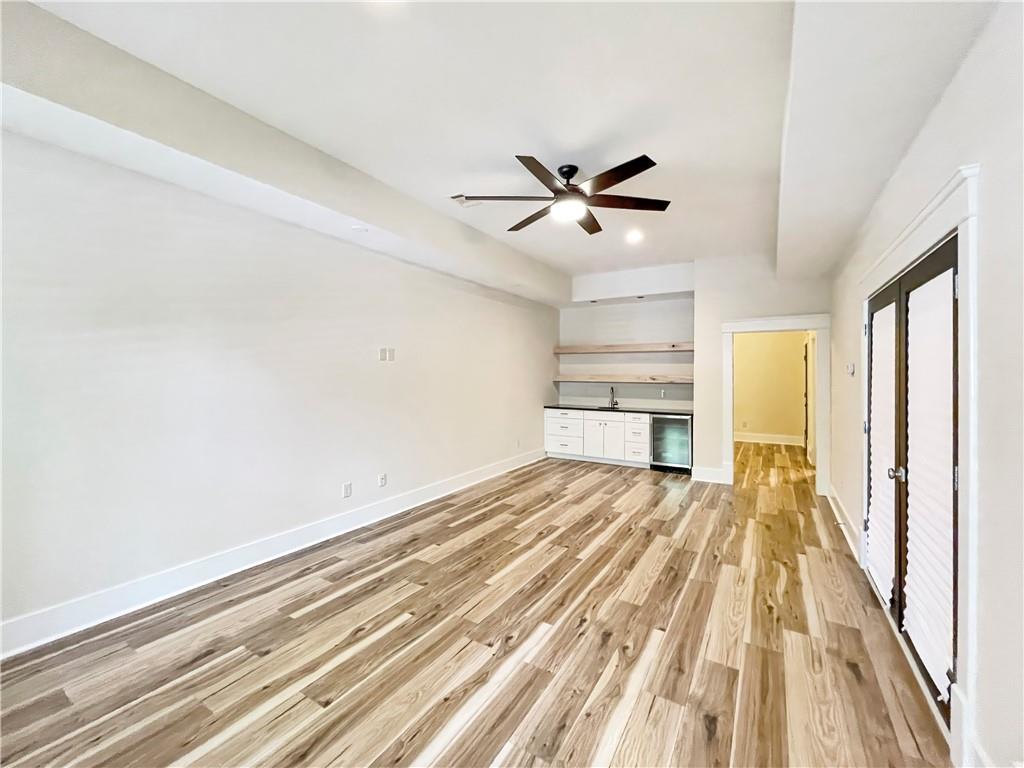 1867 Gordon Manor Northeast Atlanta, GA 30307 - Photo 24 of 34 a view of a room with wooden floor and ceiling fan