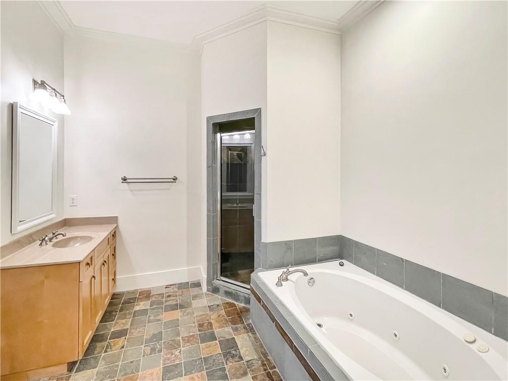 1867 Gordon Manor Northeast Atlanta, GA 30307 - Photo 25 of 34 a bathroom with a bathtub and a sink