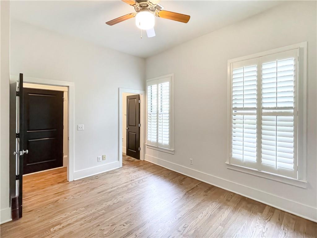 1867 Gordon Manor Northeast Atlanta, GA 30307 - Photo 29 of 34 an empty room with wooden floor and windows