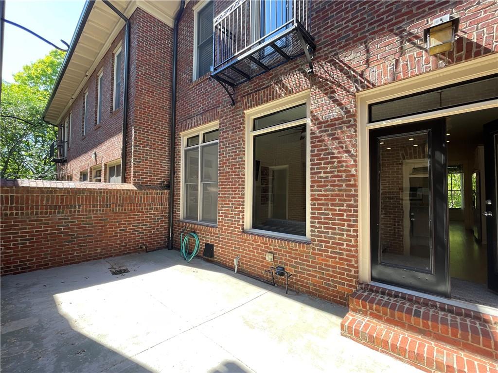 1867 Gordon Manor Northeast Atlanta, GA 30307 - Photo 32 of 34 a view of a brick house with an empty space
