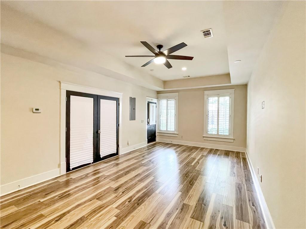 1867 Gordon Manor Northeast Atlanta, GA 30307 - Photo 6 of 34 a view of an empty room with a window and wooden floor