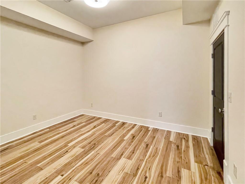 1867 Gordon Manor Northeast Atlanta, GA 30307 - Photo 7 of 34 a view of a room with wooden floor and a shower
