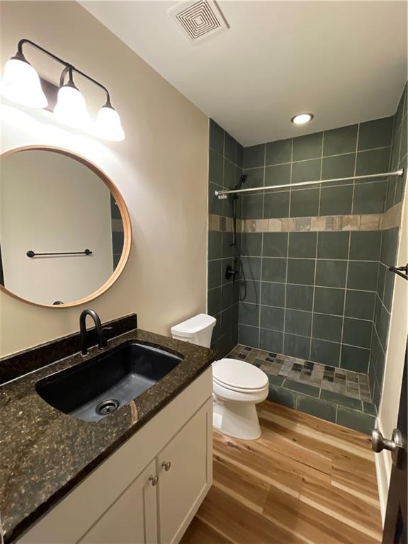 1867 Gordon Manor Northeast Atlanta, GA 30307 - Photo 8 of 34 a bathroom with a sink a toilet and a mirror