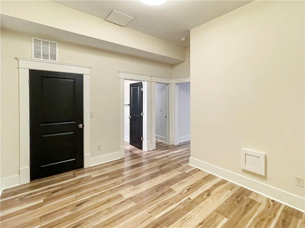 1867 Gordon Manor Northeast Atlanta, GA 30307 - Photo 9 of 34 a view of a livingroom with wooden floor and closet