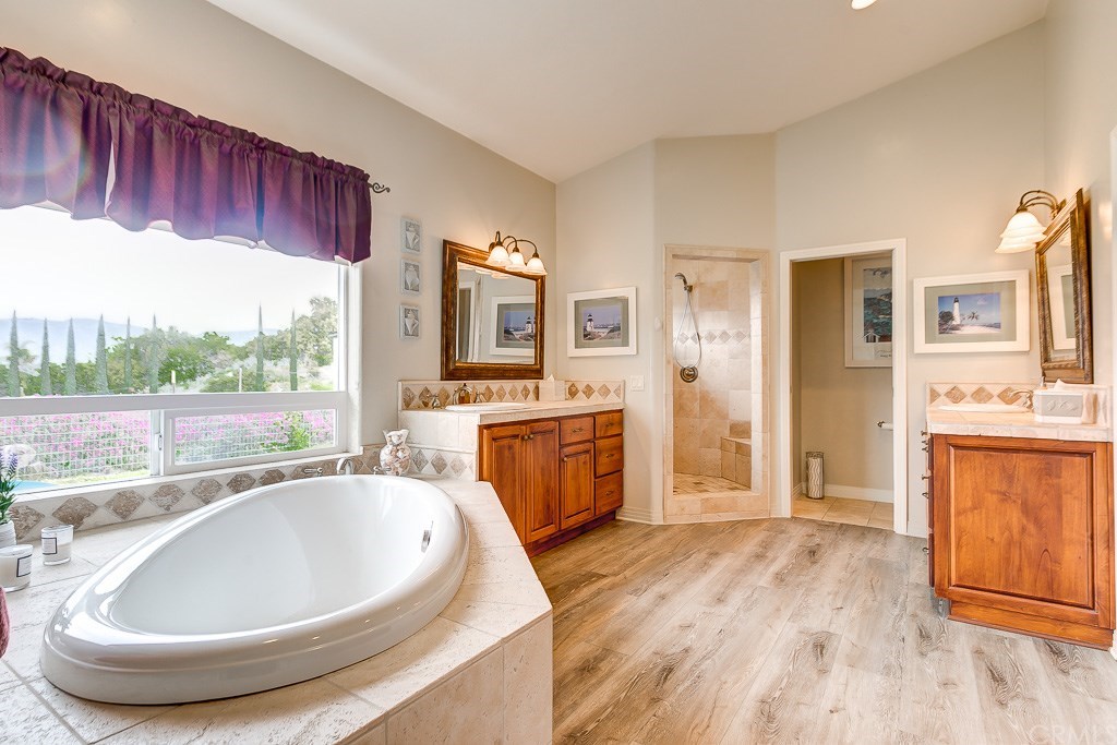 39356 American Road Fallbrook, CA 92028 - Photo 22 of 37 The master bathroom has it all - separate soaking tub and shower are detailed out in tumbled Italian marble.