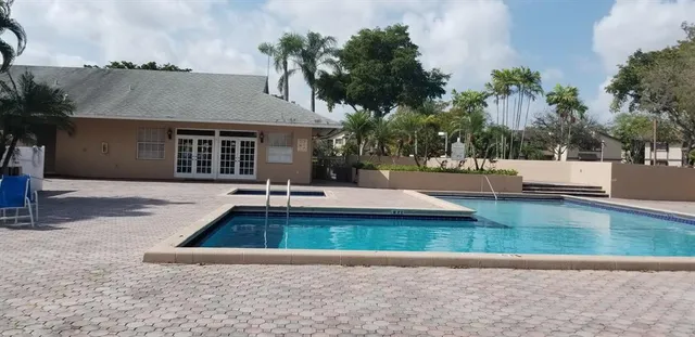 a view of a house with swimming pool