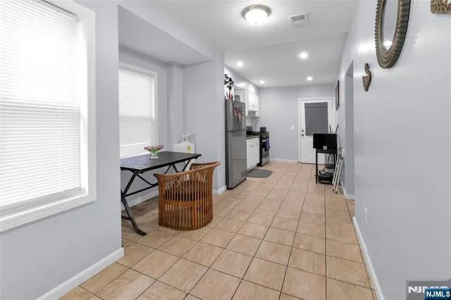 a view of kitchen with furniture and a window