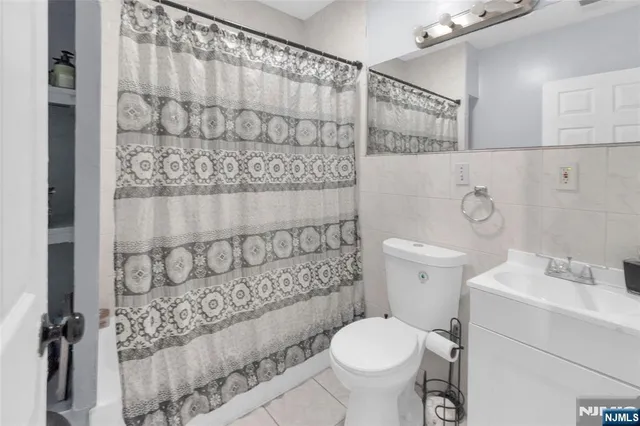 a bathroom with a toilet and shower