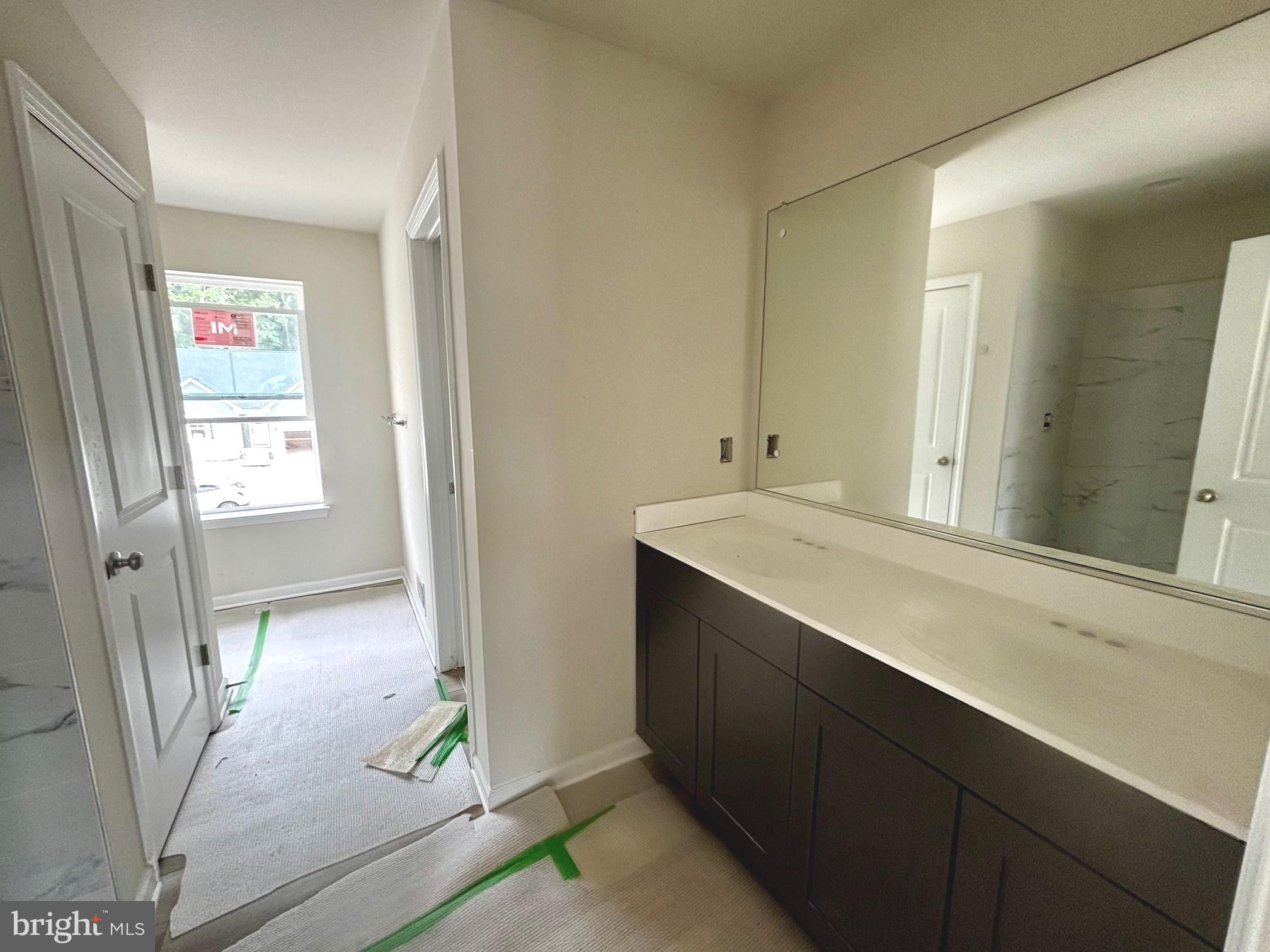 732 R Wilson Loop Georgetown, DE 19947 - Photo 11 of 41 a bathroom with a sink a mirror and a shower