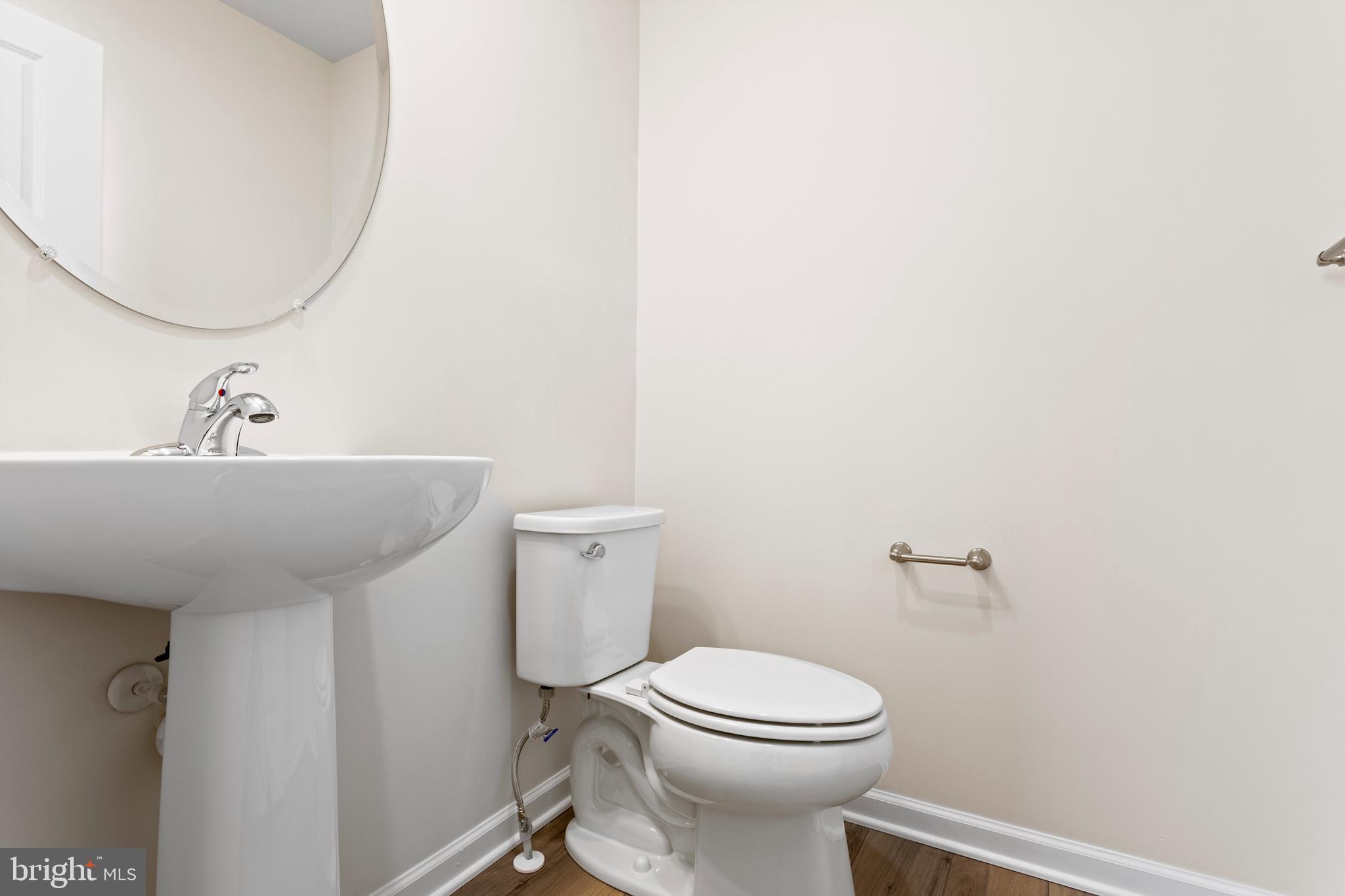 732 R Wilson Loop Georgetown, DE 19947 - Photo 21 of 41 a bathroom with a sink a toilet and mirror