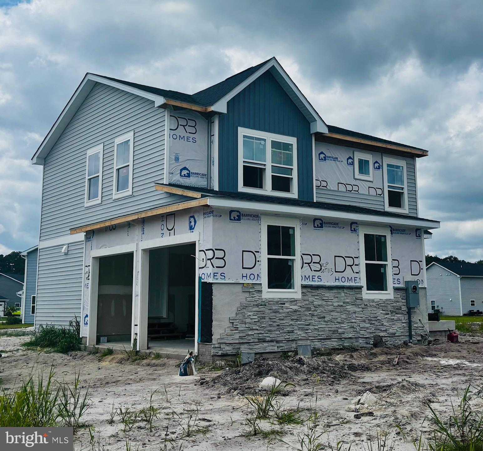 732 R Wilson Loop Georgetown, DE 19947 - Photo 3 of 41 a view of a brick house with large windows