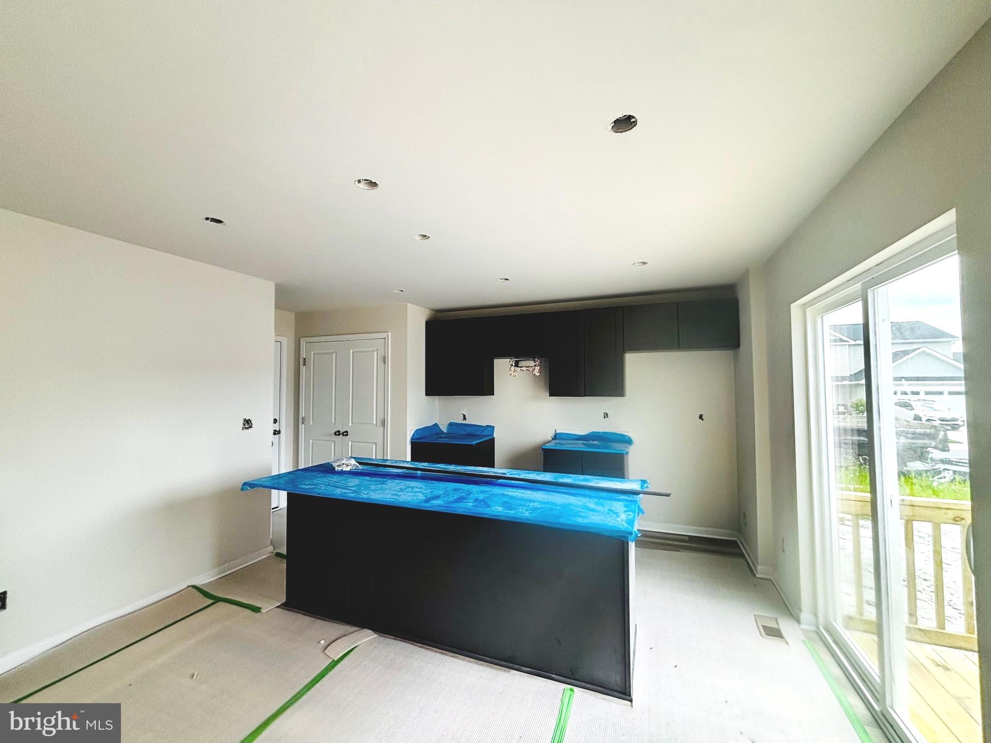 732 R Wilson Loop Georgetown, DE 19947 - Photo 5 of 41 a room with a bed and a large window