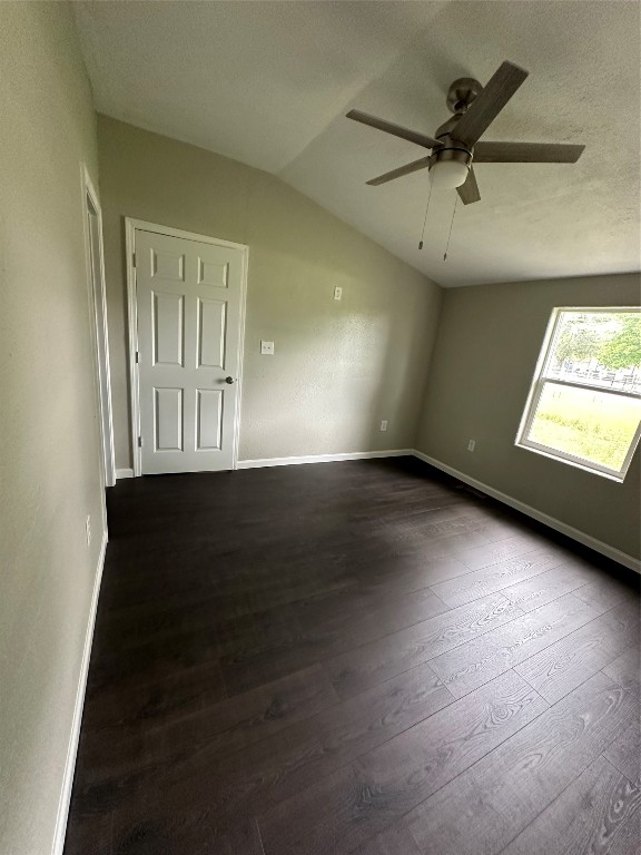 11330 Lakeview Road Brenham, TX 77833 - Photo 14 of 14 an empty room with wooden floor fan and windows
