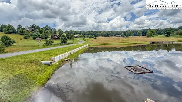 a view of a lake with a big yard
