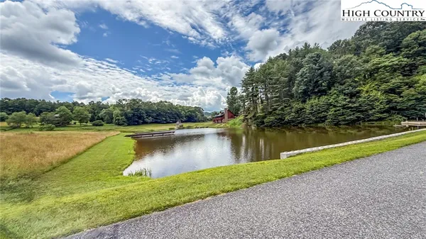 a view of a lake with a yard