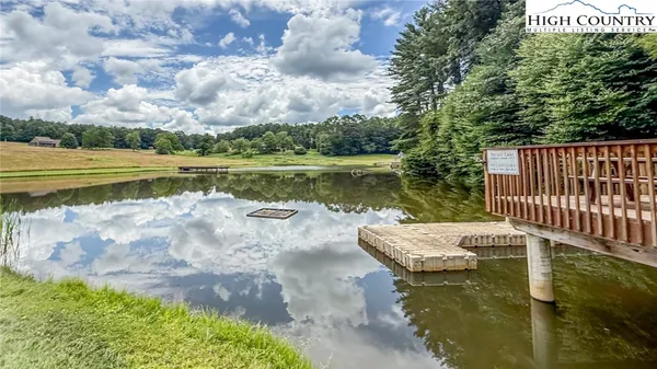 a view of a lake with a yard