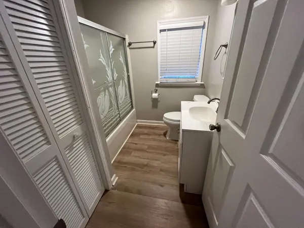 a bathroom with a sink a mirror and a shower