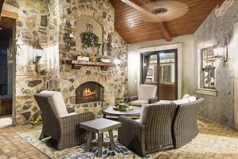 a view of a balcony with furniture