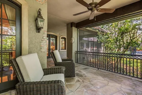 a view of a house with swimming pool and sitting area