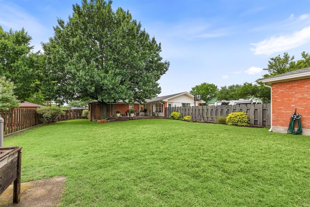 934 North Maple Street Muenster, TX 76252 - Photo 27 of 39 a yellow house in middle of the grass