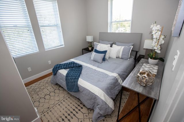 a room with furniture and a potted plant