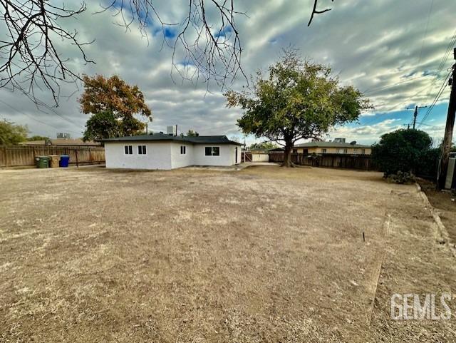 Undisclosed Address Bakersfield, CA 93306 - Photo 13 of 19 a view of a house with a dry yard