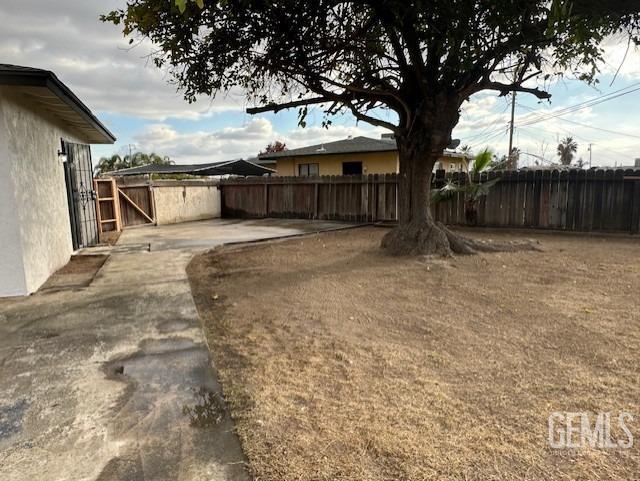 Undisclosed Address Bakersfield, CA 93306 - Photo 14 of 19 a row of trees with a house in the background