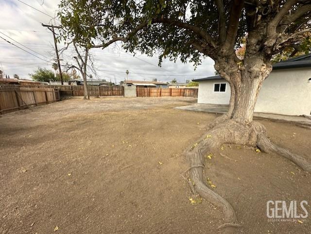 Undisclosed Address Bakersfield, CA 93306 - Photo 15 of 19 a front view of a house with a large tree