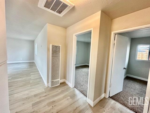 Undisclosed Address Bakersfield, CA 93306 - Photo 10 of 19 a view of a hallway with wooden floor and closet