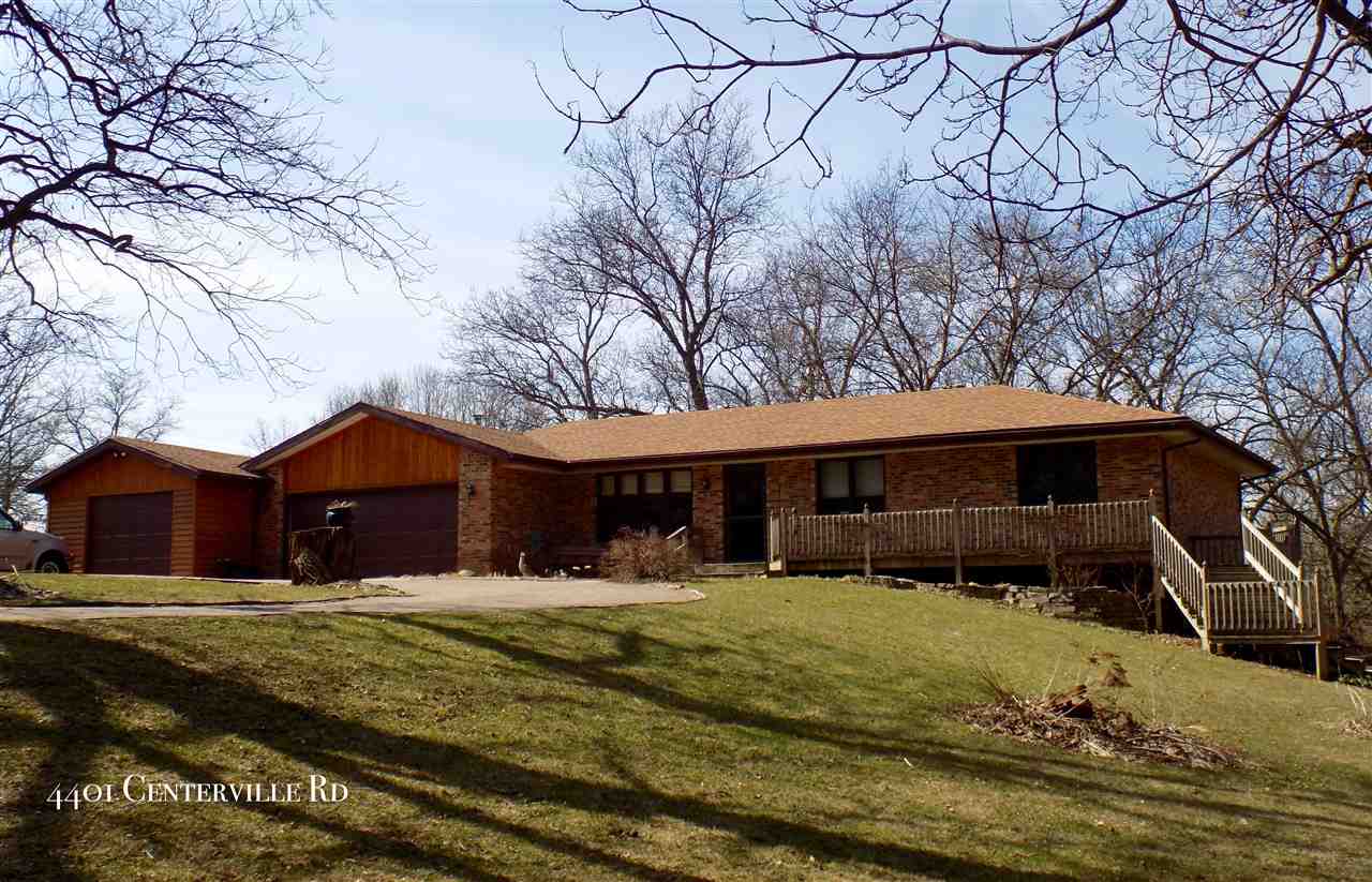 4401 Centerville Road Rockford, IL 61102 - Photo 1 of 23 a front view of a house with a yard