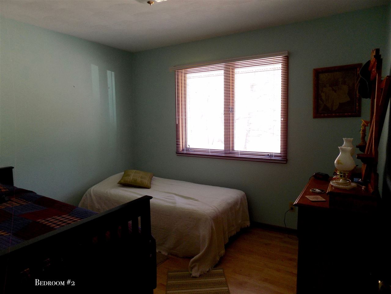 4401 Centerville Road Rockford, IL 61102 - Photo 12 of 23 a bedroom with a bed and a flat tv screen on the dresser