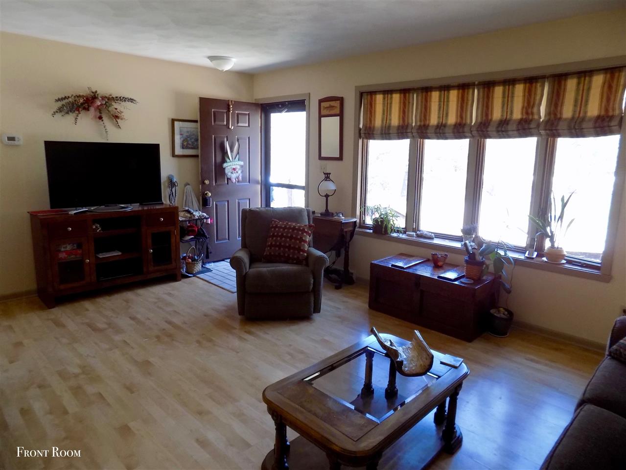 4401 Centerville Road Rockford, IL 61102 - Photo 5 of 23 a living room with furniture and a flat screen tv